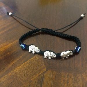 Black evil eye bracelet with elephants adjustable only $3